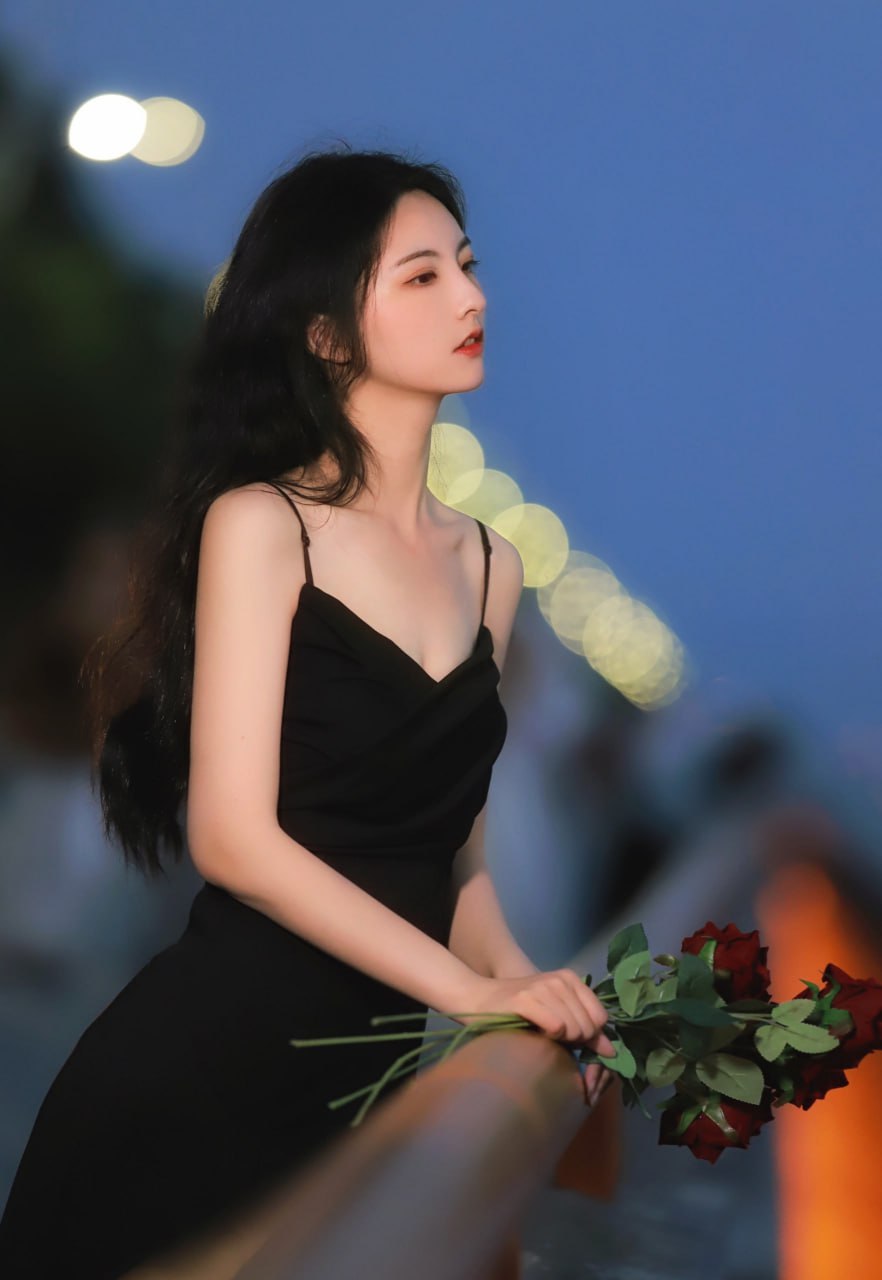 Captivating young Asian woman in soft light