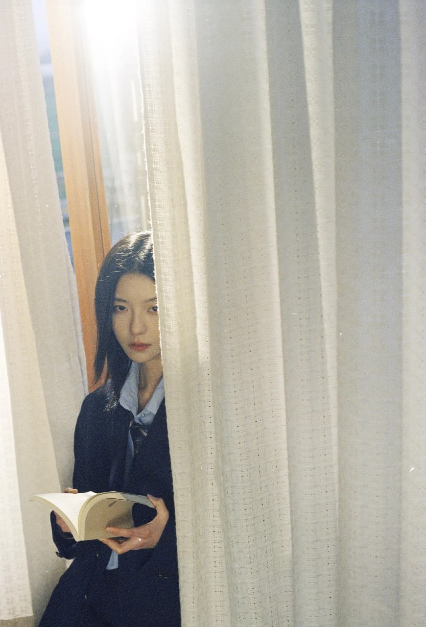 Captivating young Asian woman in soft light