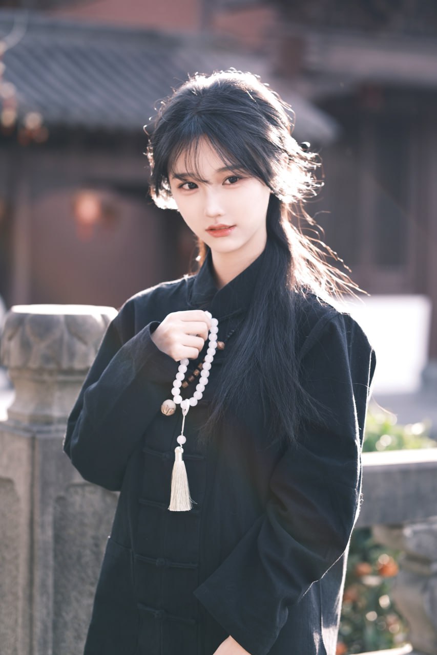 Captivating young Asian woman in soft light