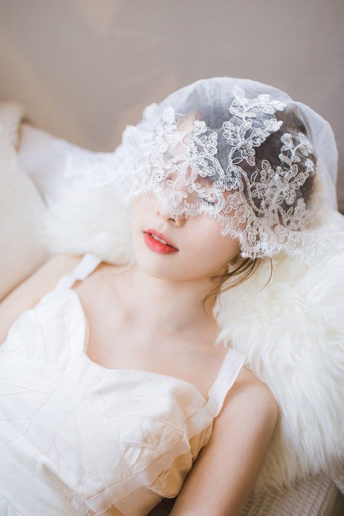 Elegant Asian woman framed by natural light