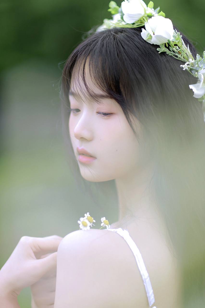 Radiant young Asian lady in a natural setting