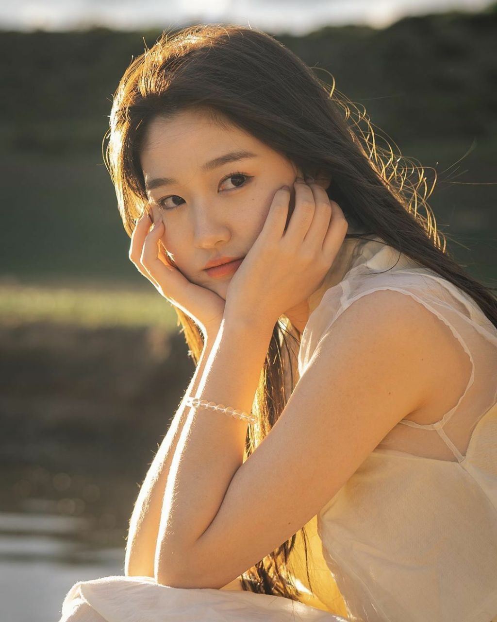 Radiant young Asian lady in a natural setting