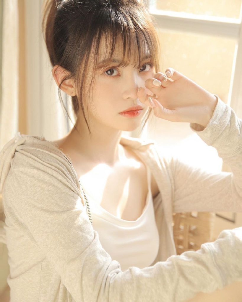 Serene and vibrant image of a young Asian lady