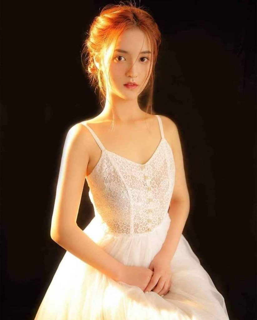 Stunning young Asian girl in a serene pose