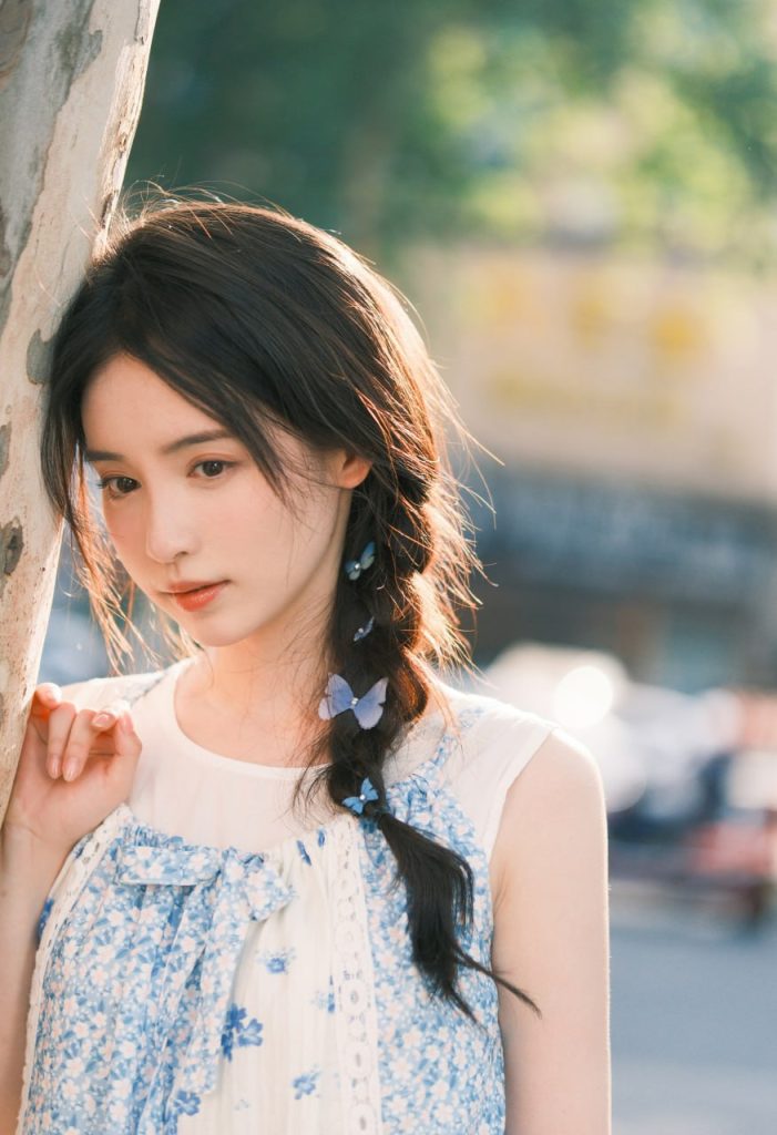 Young Asian beauty photographed in golden light