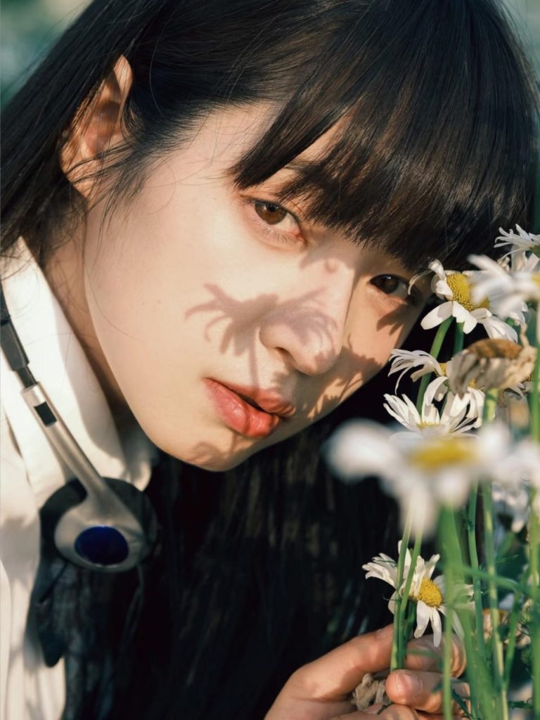 Stunning young Asian girl in a serene pose