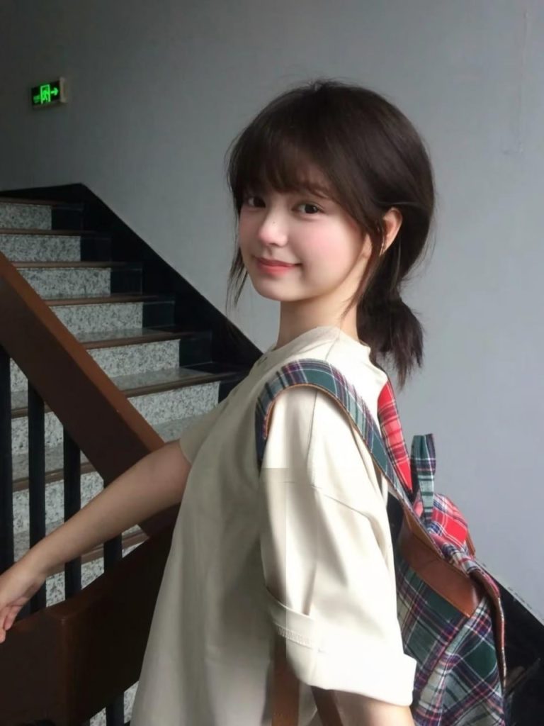 Elegant Asian woman framed by natural light