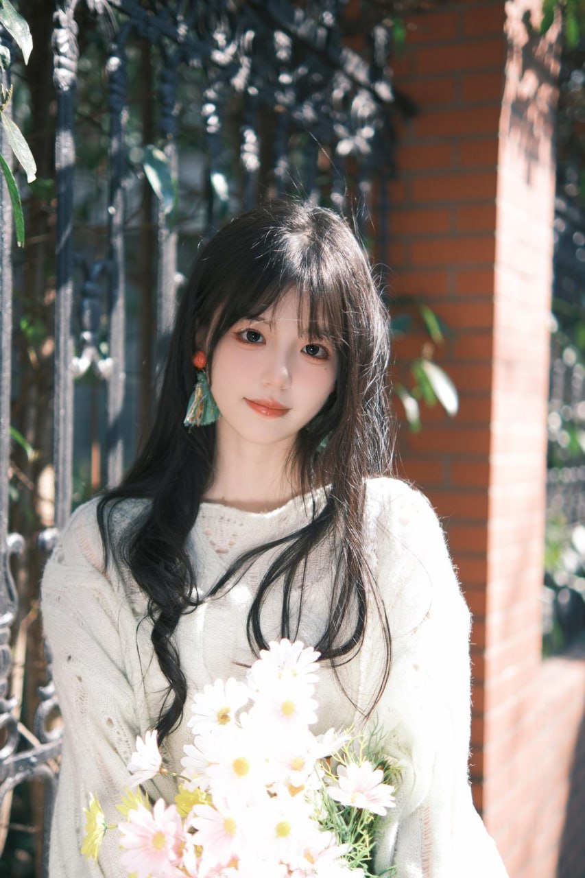 A serene photo of an enchanting Asian woman